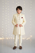 Front view of ivory textured sherwani suit for boys