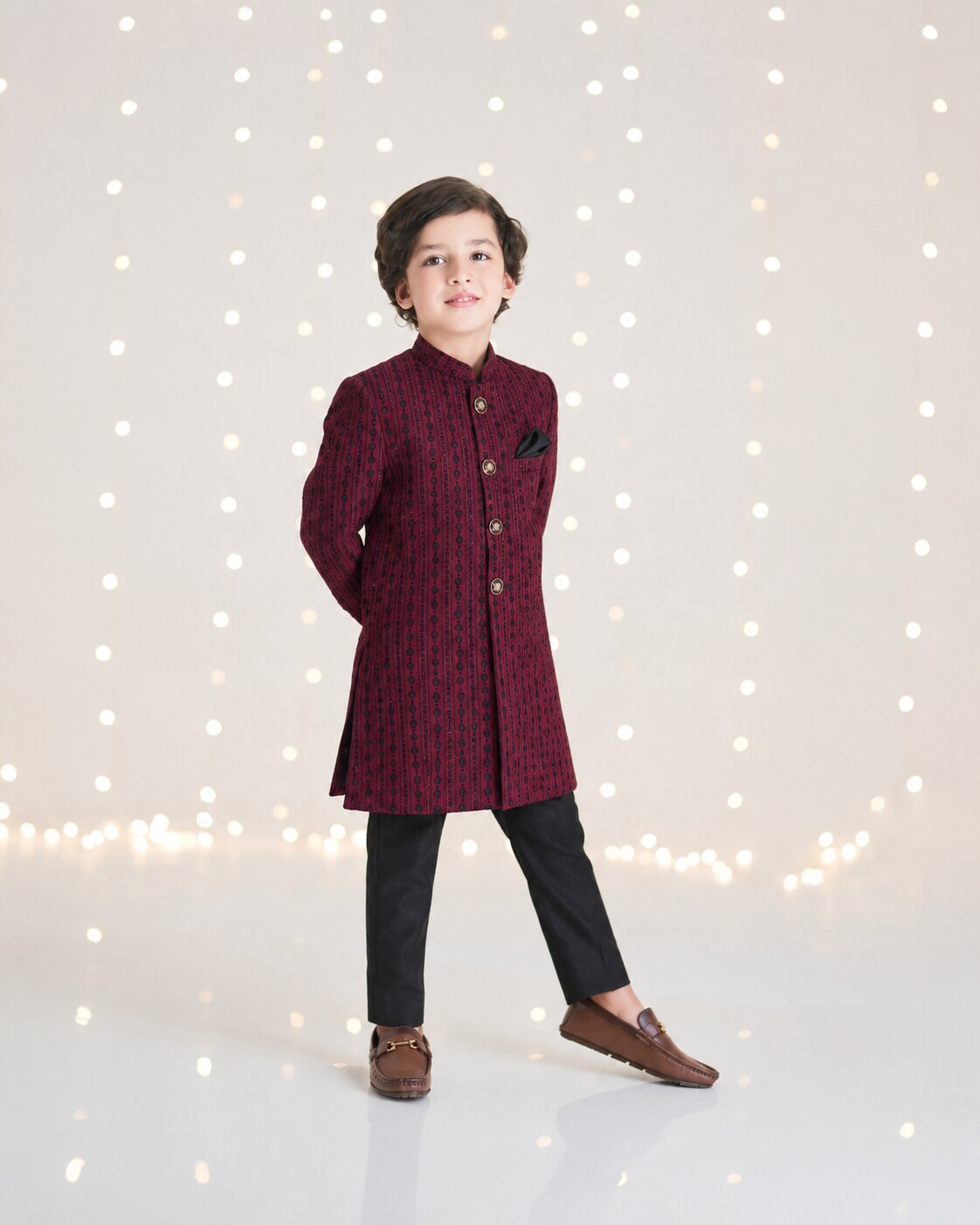 Kids maroon embroidered sherwani with black trouser - styled pose