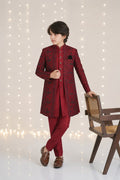 Regal Maroon Floral 3-Piece Sherwani for boys – styled chair pose